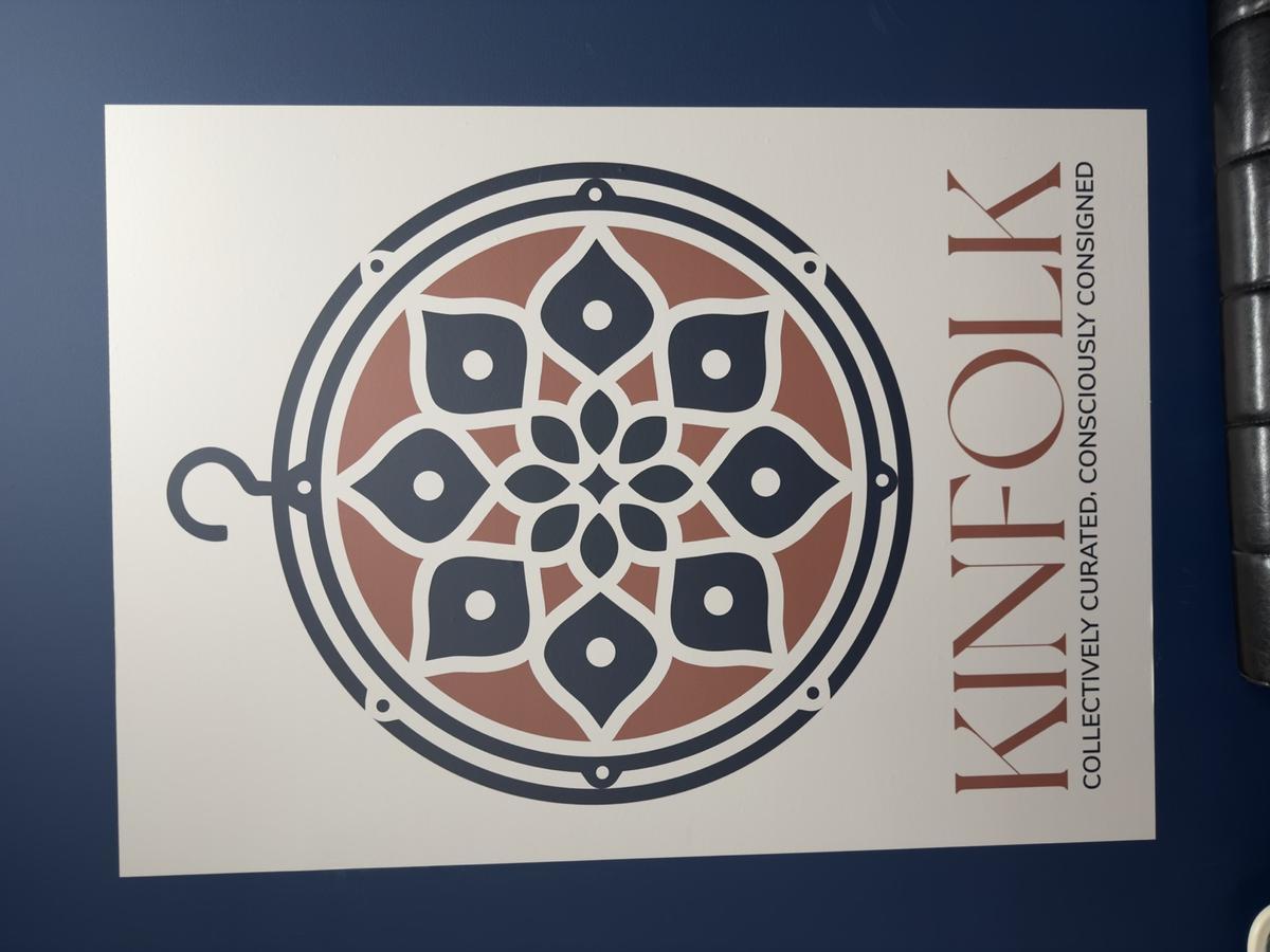 Kinfolk logo poster — Collectively Curated, Consciously Consigned